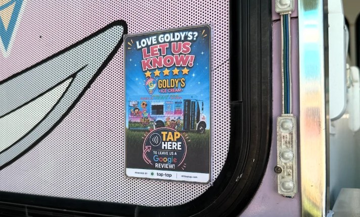 Tap-Tap NFC review sign on the serving window of the Goldy's Ice Cream truck